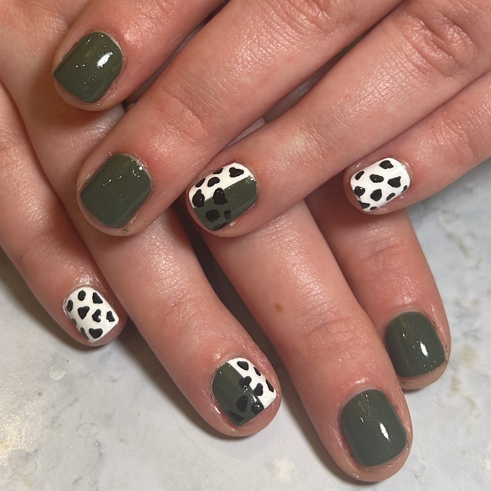 Cow Print and Plain Polish Nails